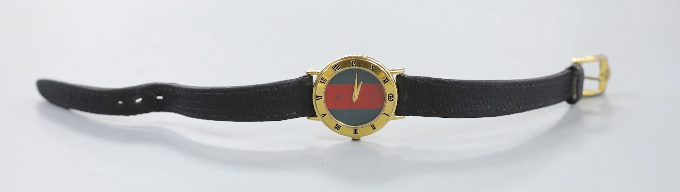 A lady's moder gold plated Gucci quartz wrist watch, no box or papers.
